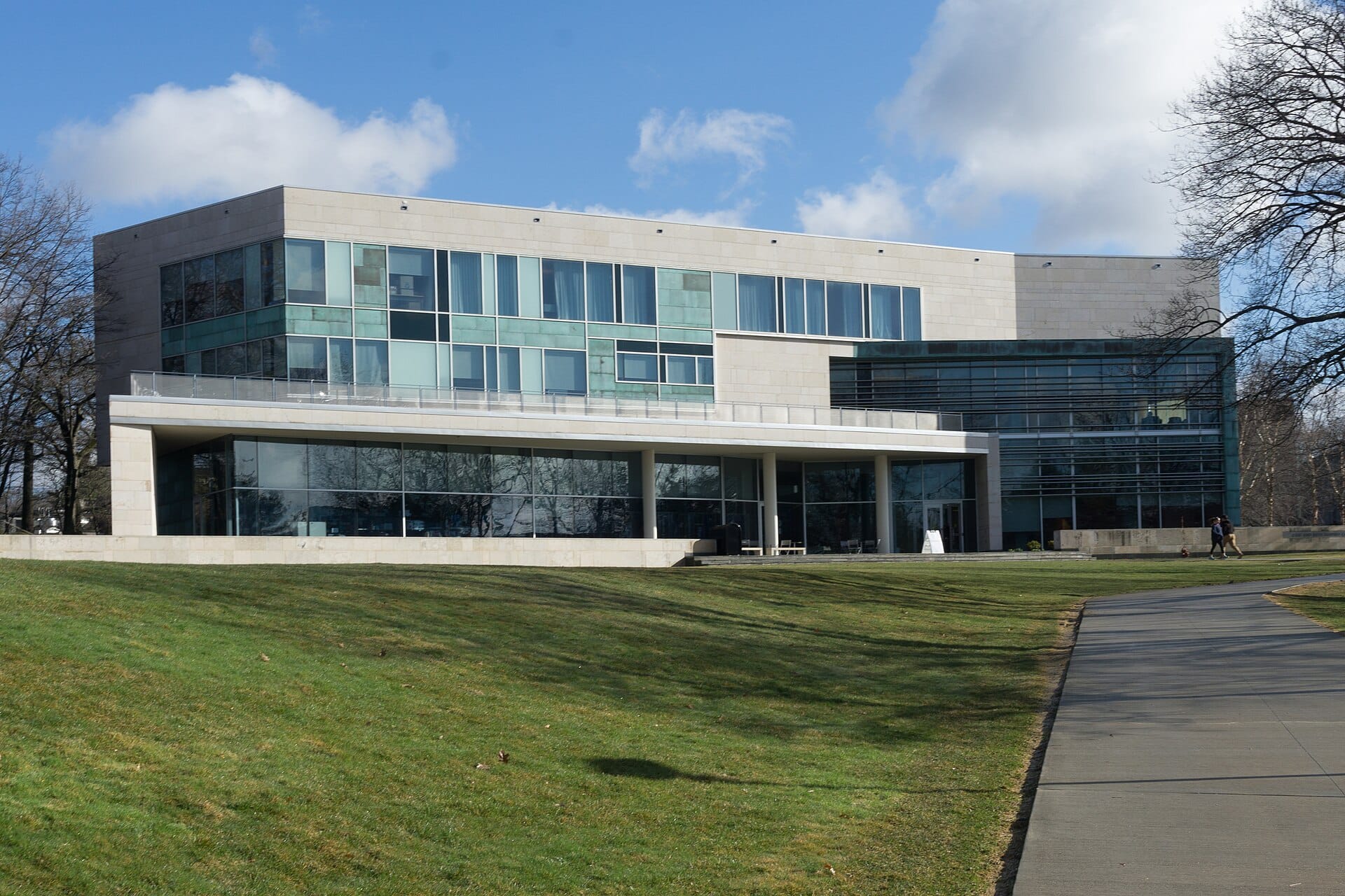 The modern Shapiro Campus Center at Brandeis University seen across a lawn